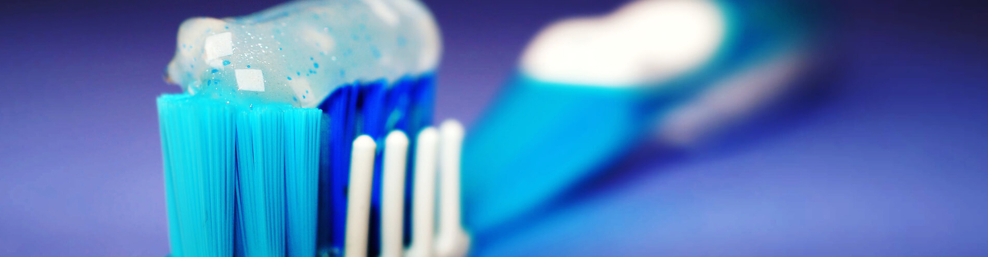 Blue and White Toothbrush with Mint Toothpaste